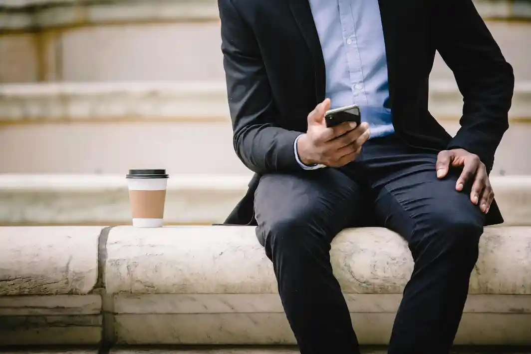 man sitting on a phone